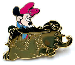 Minnie riding in a Dumbo the Flying Elephant