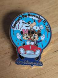 Mickey, Minnie, and Goofy in a parade car