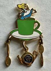 Alice in teacup with charms Grand Floridian logo